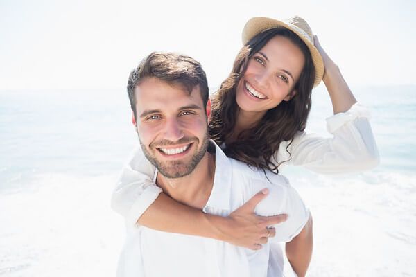 Happy couple enjoying day at the beach.